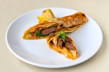 Lavash doner kebab ( zurna doner durum )  or shawarma sliced in plate isolated. 