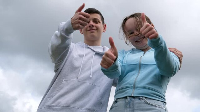 Portrait of romantic excited couple of business people freelancer scream wow look at copyspace point index finger ads tips wear denim jeans clothes isolated