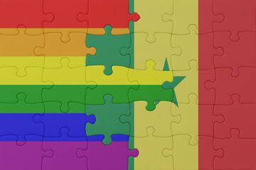 puzzle with the flag of rainbow gay pride and senegal . macro.concept.