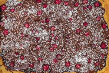 Marijuana cake with dry red currants and chocolate on arabic plate