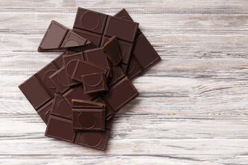Black chocolate on a gray background