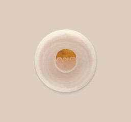 Empty cream beige and gold glitter circle drop on neutral background.