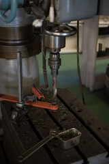 Drilling using a drill on a radial drilling machine