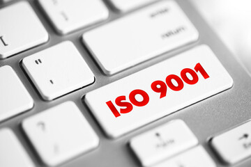 ISO 9001 - international standard that specifies requirements for a quality management system, text concept button on keyboard - obrazy, fototapety, plakaty