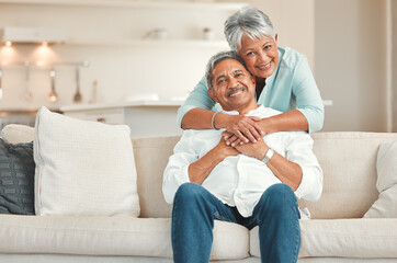 As in-love as the first day. a happy senior couple relaxing on the sofa at home. - obrazy, fototapety, plakaty
