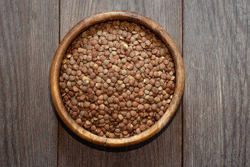 wooden bowl with lentils, vegan source of protein, healthy balanced diet