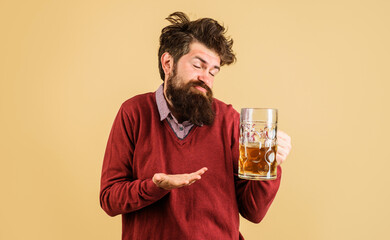 Celebration oktoberfest festival. Drunk man with craft beer mug. Man drinking draught beer at bar...