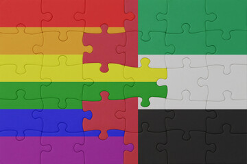 puzzle with the flag of rainbow gay pride and united arab emirates . macro.concept.