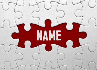 Fototapeta premium Word NAME?on red puzzle background