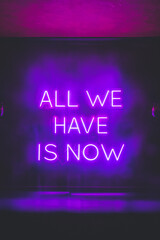 "All we have is now" purple neon light.