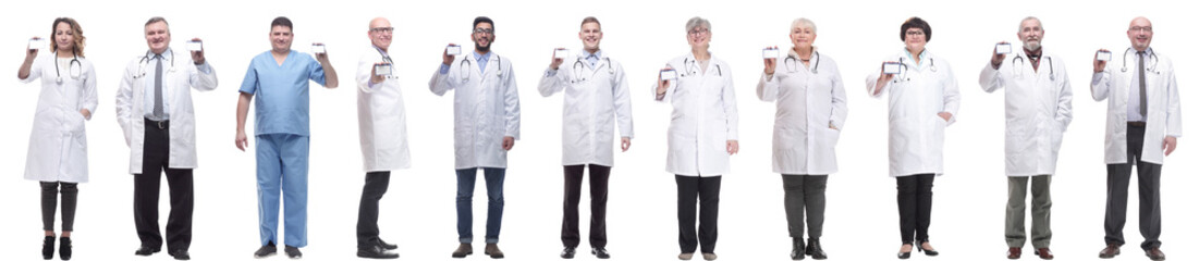 Fototapeta premium full length group of doctors showing badge isolated