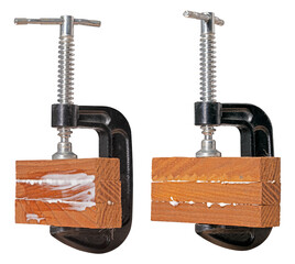 Small wood clamp with glued material. Three pieces of wood held together with carpenter's glue in a...