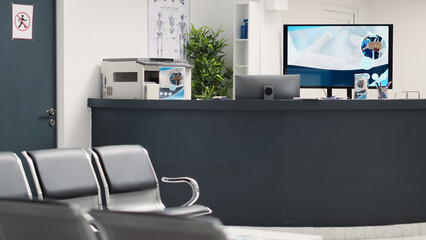 Hospital waiting room in medical center, empty reception open space with seats and health care leaflets. Waiting area lobby in emergency clinic for clinical appointments and disease examination.