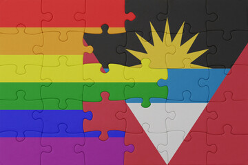 puzzle with the flag of rainbow gay pride and antigua and barbuda . macro.concept.