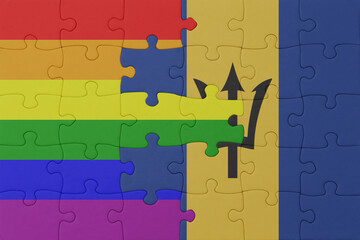 puzzle with the flag of rainbow gay pride and barbados . macro.concept.