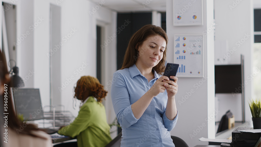 Aufkleber executive manager browsing internet on mobile phone, using online social media app in office. employ