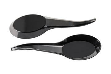 Plastic black disposable spoon isolated on a white background. Full depth of field. Close-up
