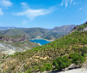 Fototapeta na wymiar Blue lake in Sierra Nevada National Park, near Granada, Spain. Summer mountain landscape.