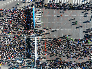 23rd of April 2023, Belgrade, Serbia. Shot of a group of young men running a marathon. Aerial drone photo.