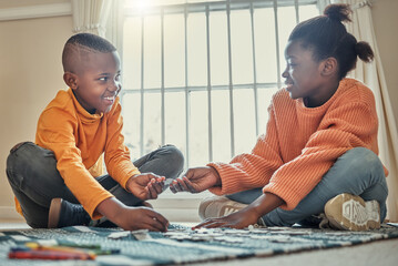 You can build this piece. a brother and sister building a puzzle together at home.