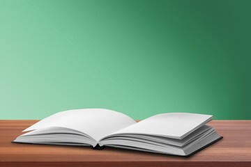 Open Bible book on wooden table