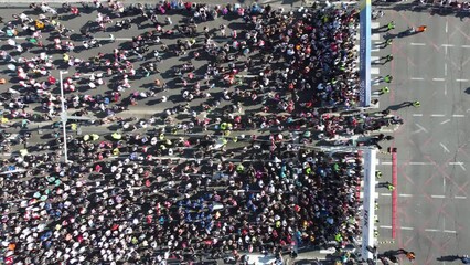 23rd of April 2023, Belgrade, Serbia Aerial drone photo view of people running a marathon in the city. From above.