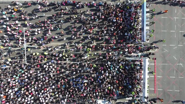 23rd of April 2023, Belgrade, Serbia Aerial drone photo view of people running a marathon in the city. From above.