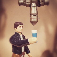 Naklejka premium BLOOMFIELD, NEW JERSEY - MAY 14, 2015: Vintage Kenner Star Wars figure Han Solo and bounty hunter IG-88 - blue milk concept. IG-88's head was a recycled drink dispenser prop from the bar in Mos Eisley