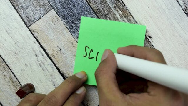 Concept of Science write on sticky notes isolated on Wooden Table.