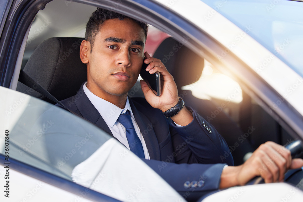 Poster making those important calls on the go. cropped portrait of a handsome young businessman making a ph