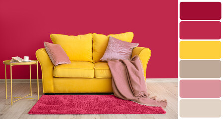 Stylish interior of room with yellow sofa near viva magenta wall. Different color patterns
