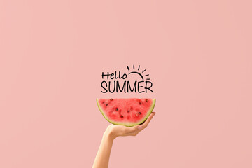 Hand with piece of ripe watermelon and text HELLO, SUMMER on pink background - obrazy, fototapety, plakaty