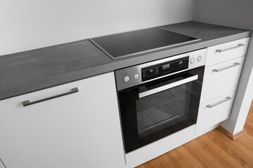 Modern electric oven in light kitchen