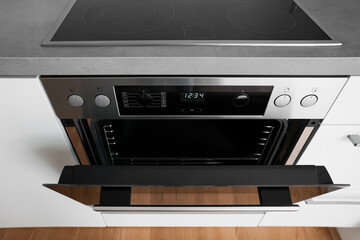 Modern electric oven in light kitchen, closeup