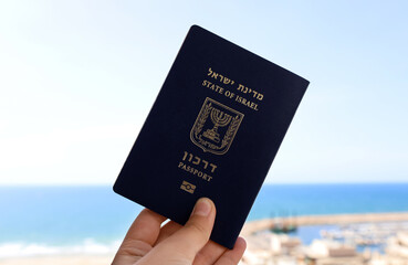 Woman with passport of Israel outdoors, closeup