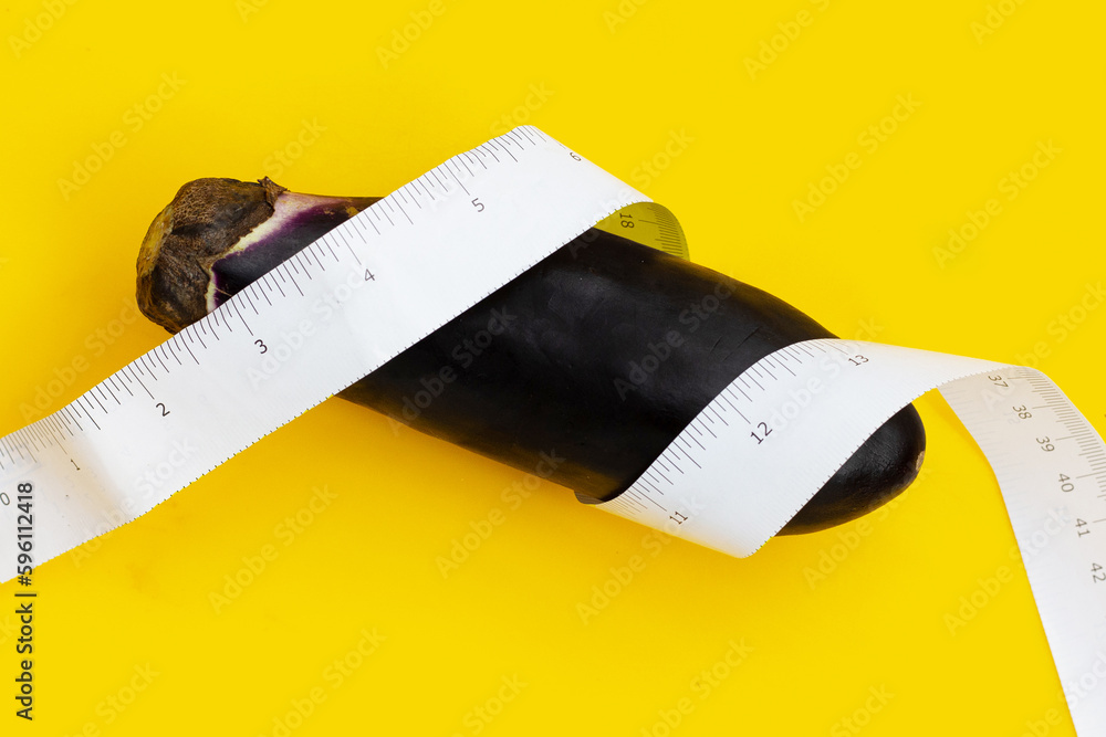 Sticker Eggplant with measuring tape on yellow background.