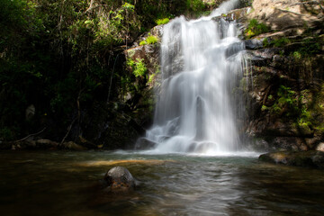 Fototapeta na wymiar Waterfall in the forest. Cascata da Cabreia, Portugal, Europe