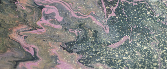 Fantasy fluid art background with dark green, orange and pink tints. Dirty marble effect of acrylic...