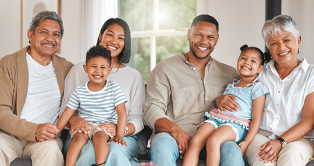 Love resides here. Portrait of a family with their grandparents on the couch at home.