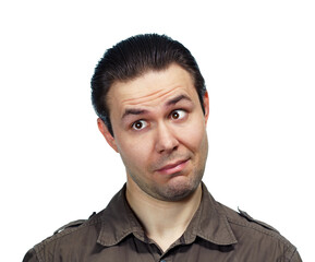 Fototapeta premium Young surprised man looking aside, emotional portrait on white background