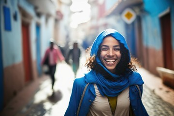 Exploring the vibrant blue streets of Morocco with a joyful tourist woman posing for the camera. Ai generated. - obrazy, fototapety, plakaty