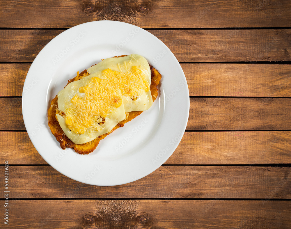 Sticker Green plantain patacon with shredded chicken and cheese - Colombian street food