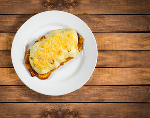 Green plantain patacon with shredded chicken and cheese - Colombian street food