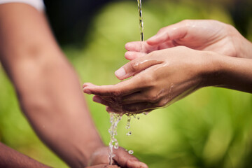 To see tomorrow, save today. unrecognisable people ringing their hands with water outside.