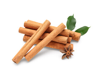 Cinnamon sticks with leaves and anise on white background