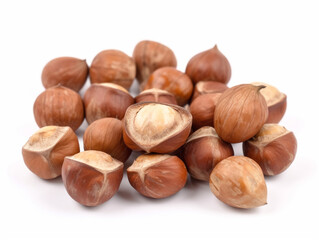 A pile of hazelnuts on a white background