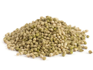 A pile of hemp seeds on a white background