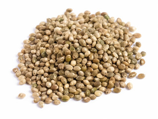 A pile of hemp seeds on a white background