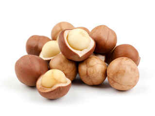 A pile of hazelnuts on a white background