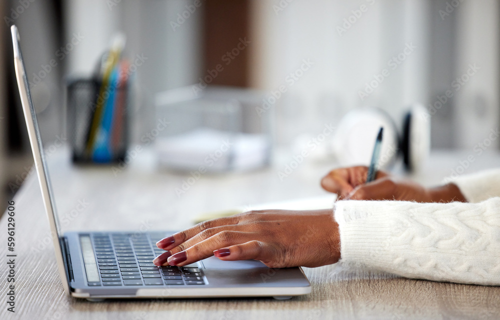Poster home is the place for productivity. an unrecognisable woman making notes in a book while studying at